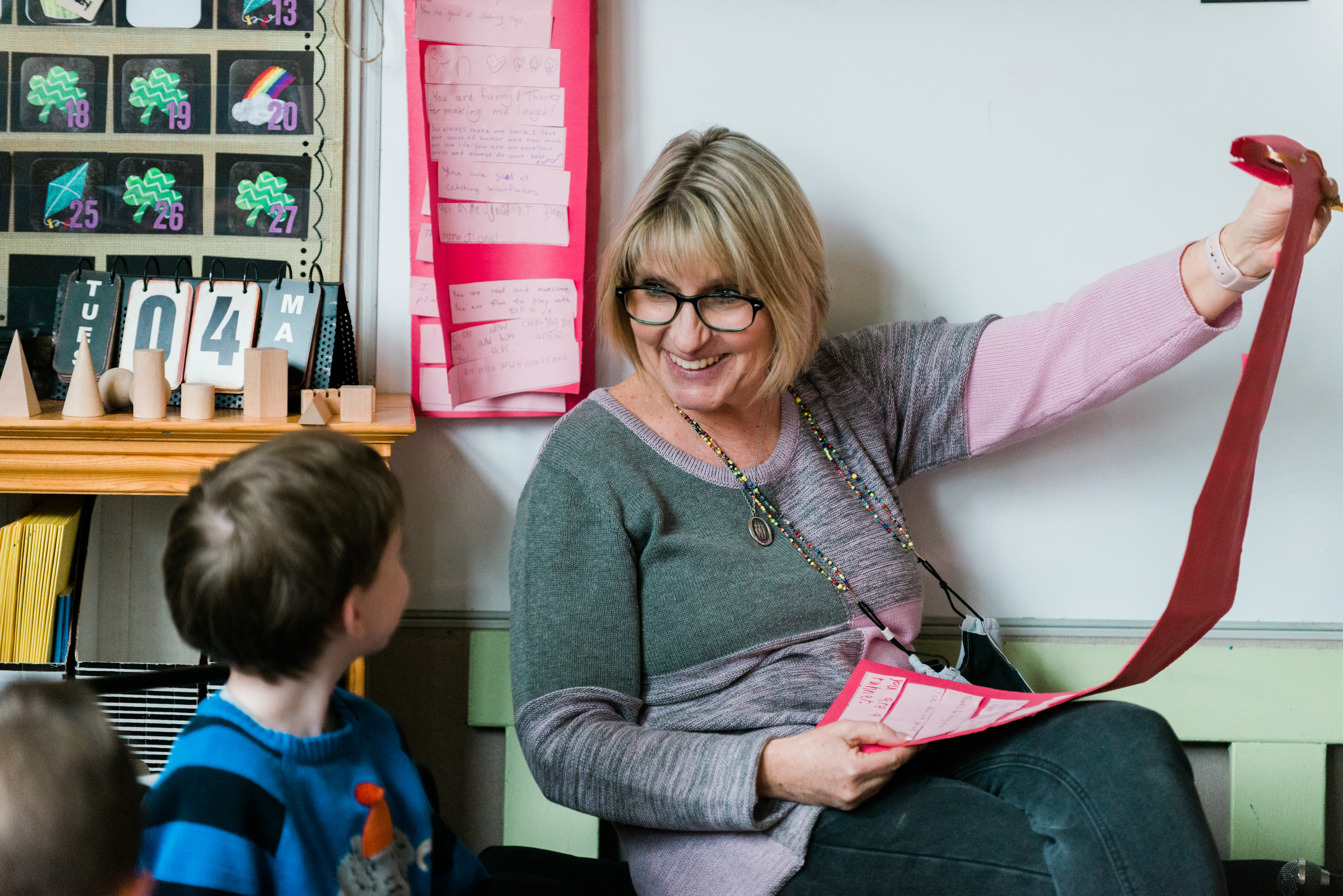 teacher smiling at child