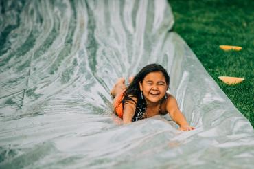 child on waterslide
