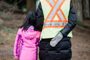 school aide with child