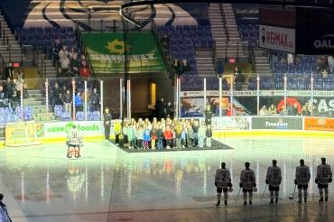 school choir at hockey game