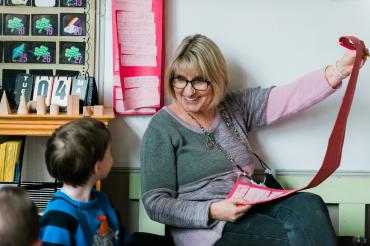 teacher smiling at child