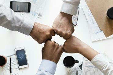 Meeting hands connecting