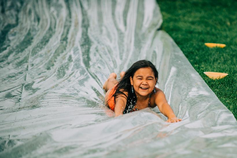 child on waterslide