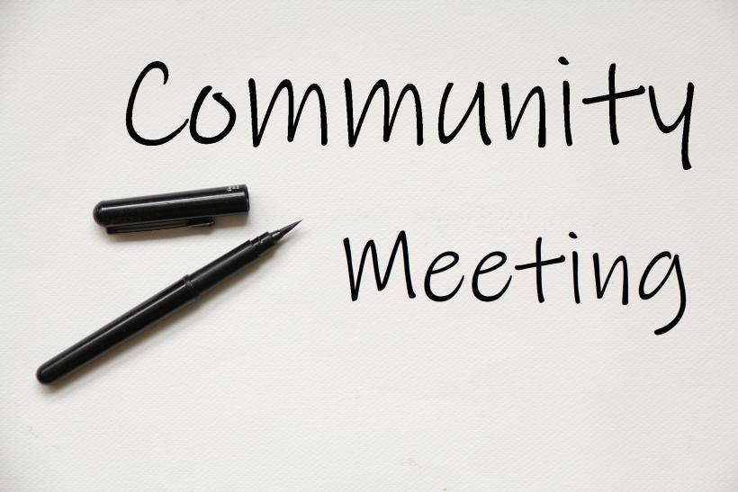 Community Meeting sign and pen